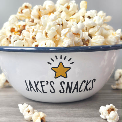 Kids Personalised white metal enamel snack bowl. White enamel metal bowl with navy blue rim. Printed with a yellow star or red heart and a name with snacks written underneath. Perfect for popcorn, sweets, crisps or general snacks.