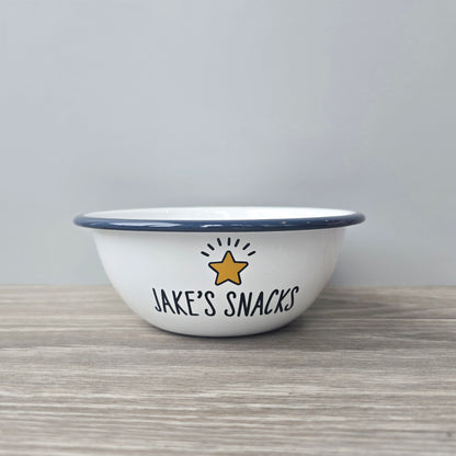 Kids Personalised white metal enamel snack bowl. White enamel metal bowl with navy blue rim. Printed with a yellow star or red heart and a name with snacks written underneath. Perfect for popcorn, sweets, crisps or general snacks.