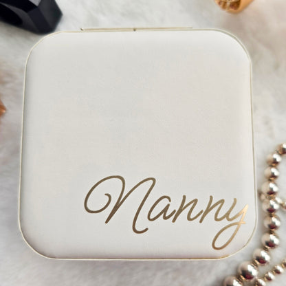 Faux leather, travel jewellery box personalised with a name in the middle in the bottom corner. Travel size jewellery case with zip and internal jewellery dividers.
