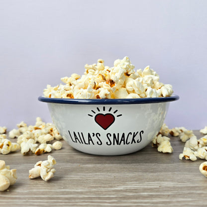Kids Personalised white metal enamel snack bowl. White enamel metal bowl with navy blue rim. Printed with a yellow star or red heart and a name with snacks written underneath. Perfect for popcorn, sweets, crisps or general snacks.