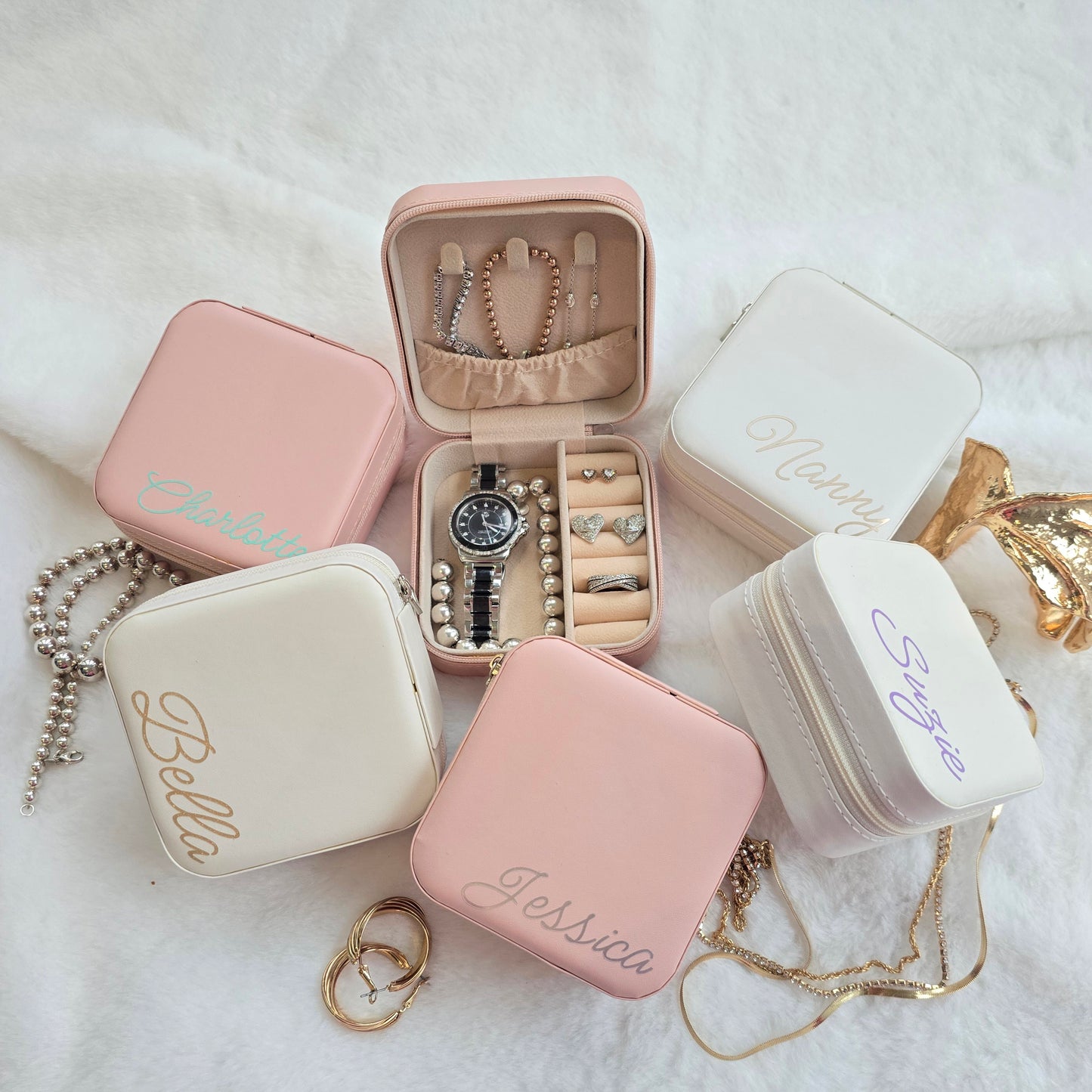 Faux leather, travel jewellery box personalised with a name in the middle in the bottom corner. Travel size jewellery case with zip and internal jewellery dividers.