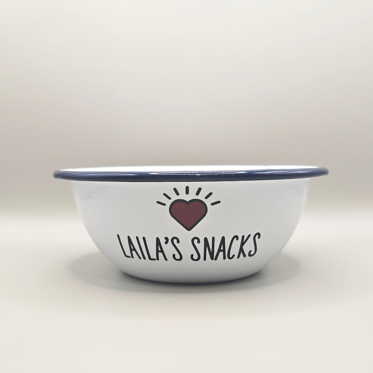 Kids Personalised white metal enamel snack bowl. White enamel metal bowl with navy blue rim. Printed with a yellow star or red heart and a name with snacks written underneath. Perfect for popcorn, sweets, crisps or general snacks.
