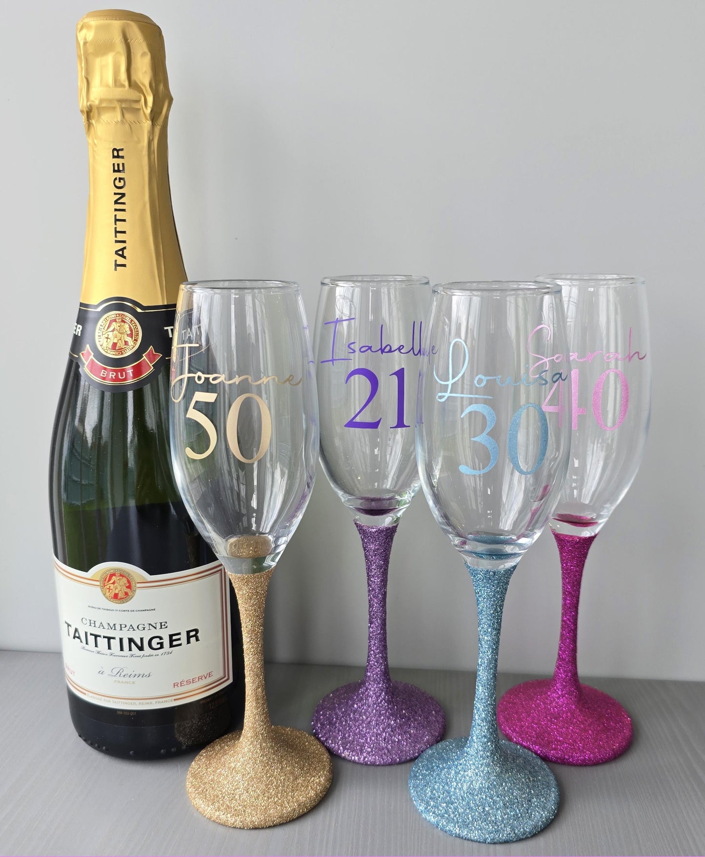Personalised glitter stem prosecco glass or champagne flute in gold, pink, purple or Blue. Signature style custom name and an age underneath