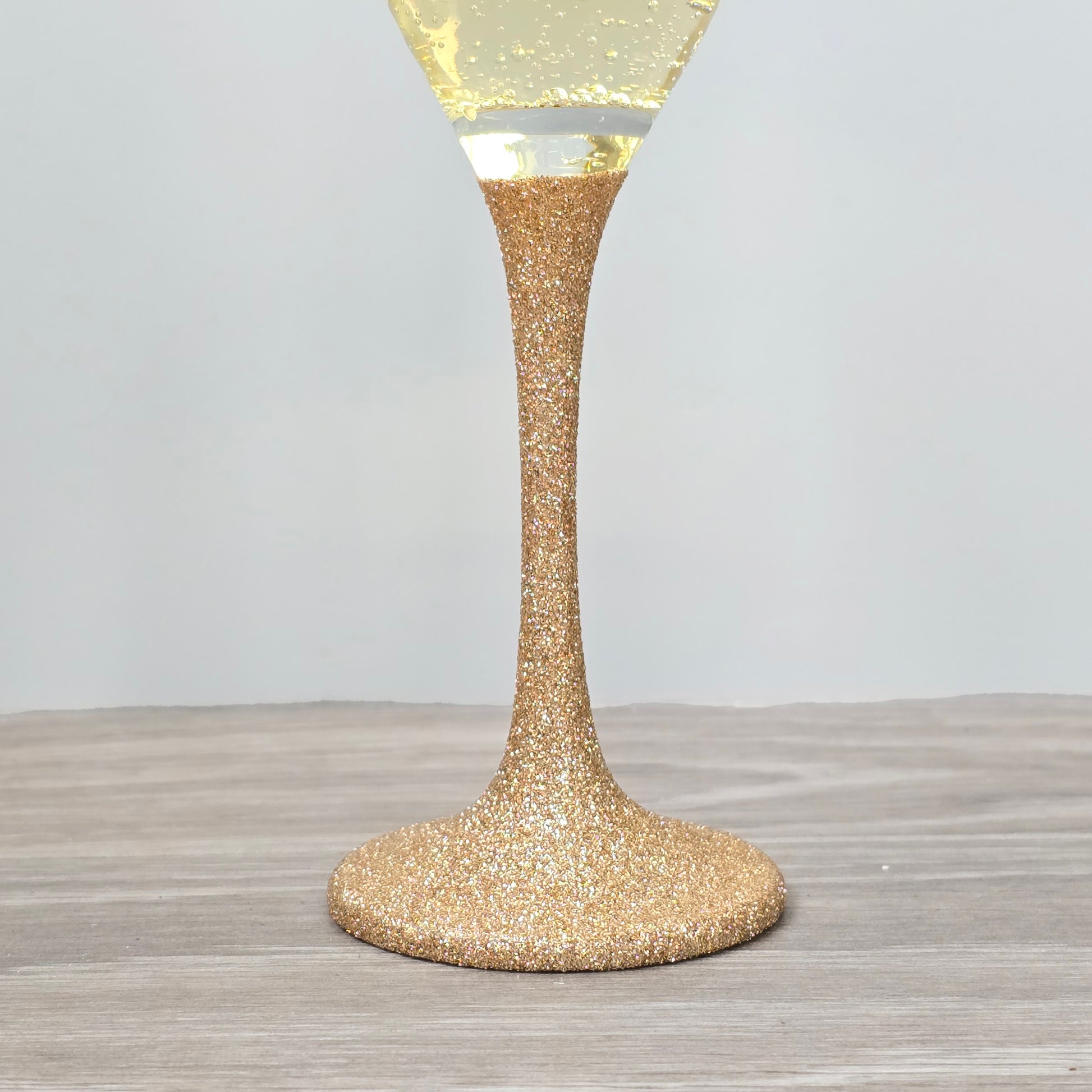 Prosecco glass or Champagne flute decorated with high shine glitter stem and personalised with 21 + the number of months to make up a 30th, 40th, 50th, 60th or 70th Birthday.