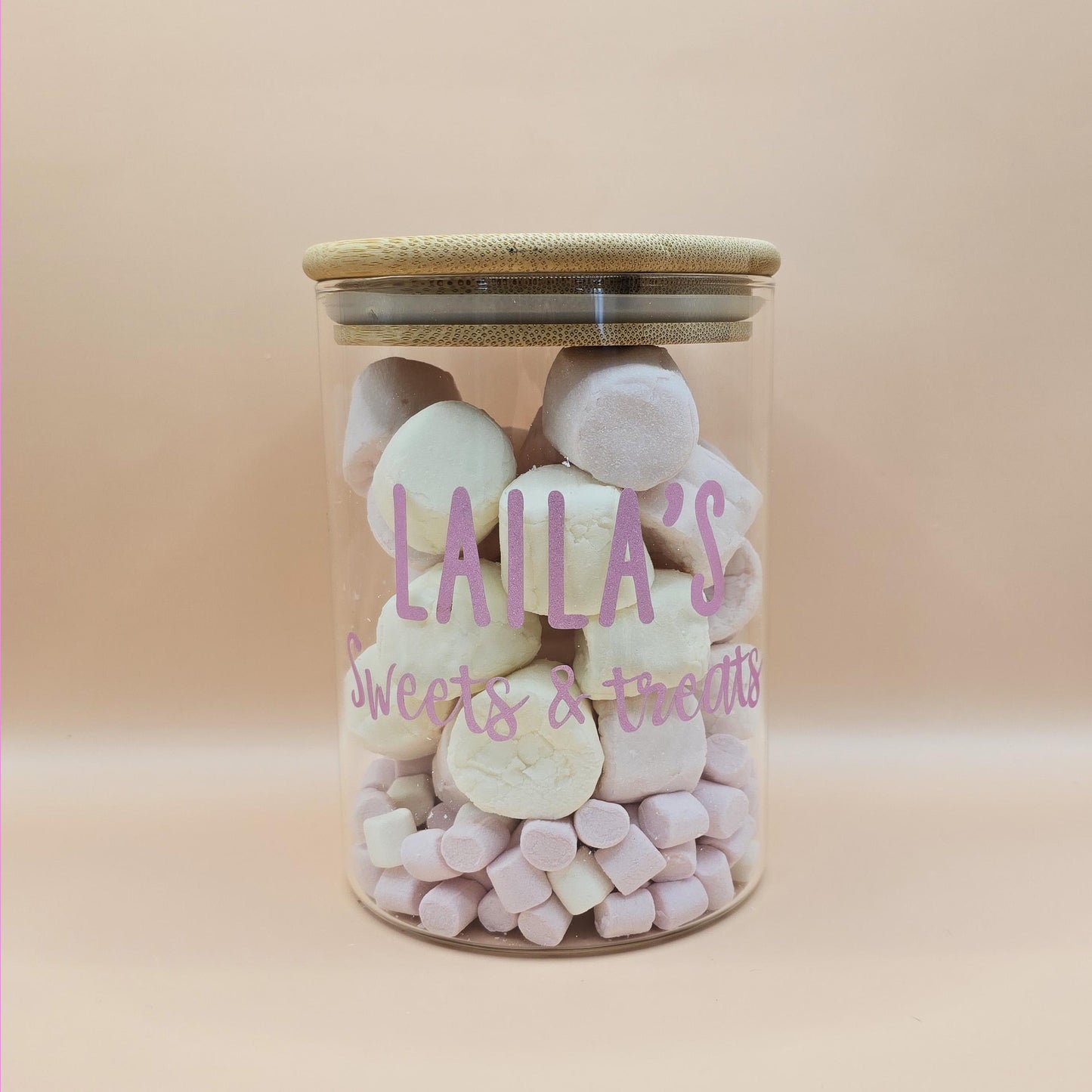 Jar of marshmallows with 'Laila's Sweets & Treats' text on a beige background