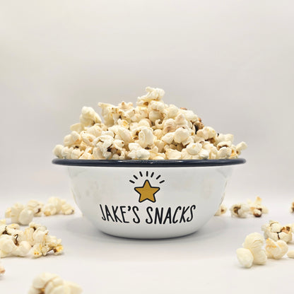 Kids Personalised white metal enamel snack bowl. White enamel metal bowl with navy blue rim. Printed with a yellow star or red heart and a name with snacks written underneath. Perfect for popcorn, sweets, crisps or general snacks.
