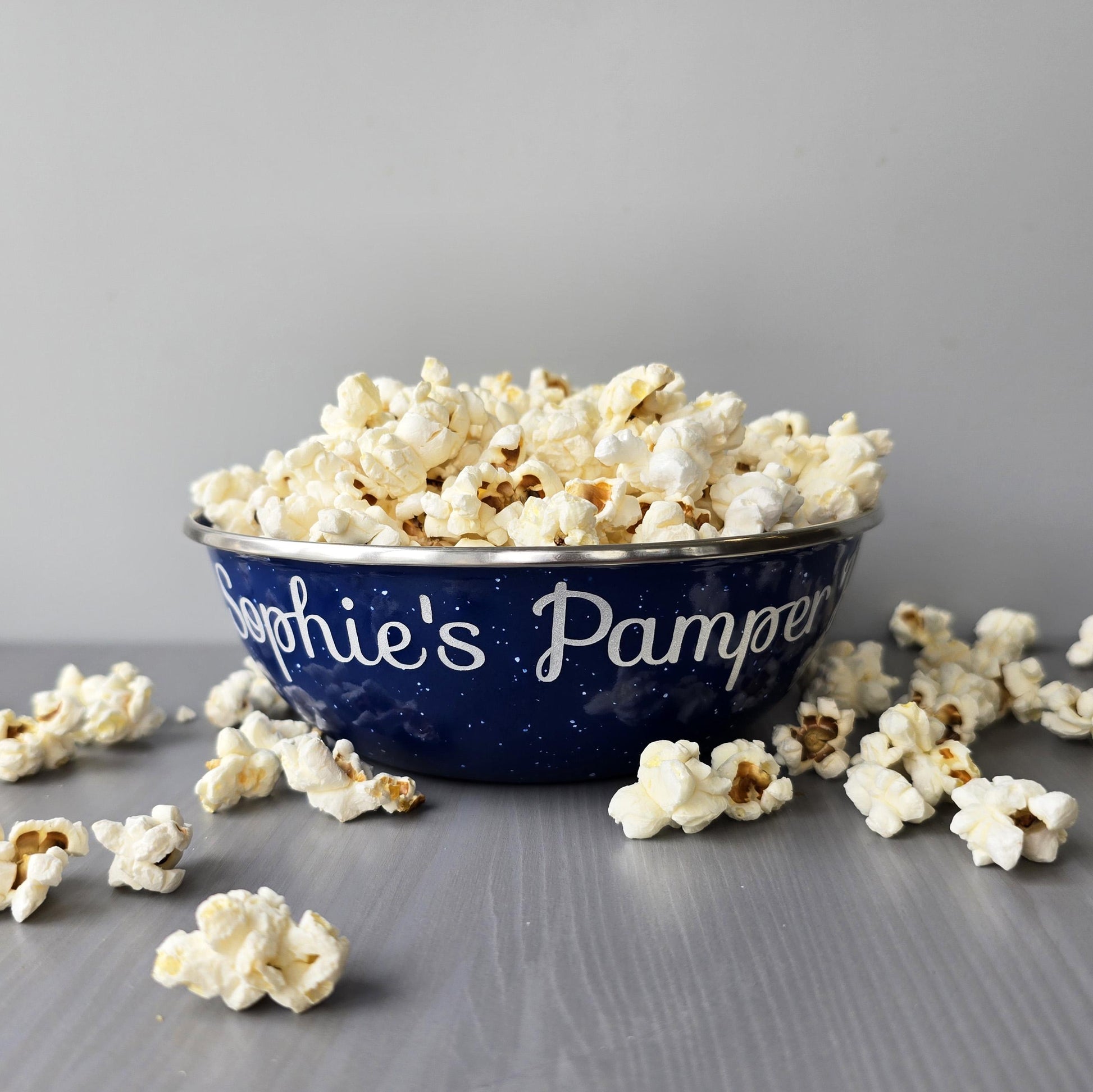 Blue steel enamel metal snack bowls with pamper night snacks printed in silver decorative font.