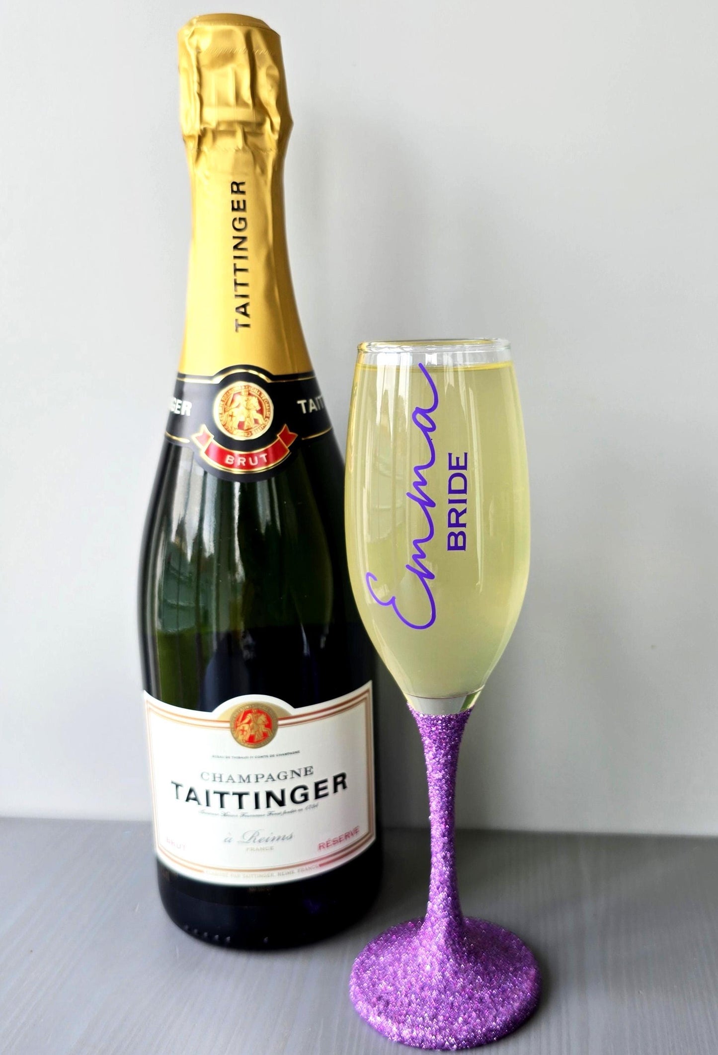 Prosecco glass or Champagne flute decorated with high shine glitter stem and personalised with a name in decorative font and wedding roll – Bride, Groom, Mother of the Bride, Bridesmaid, Sister of the bride, Maid of Honour.