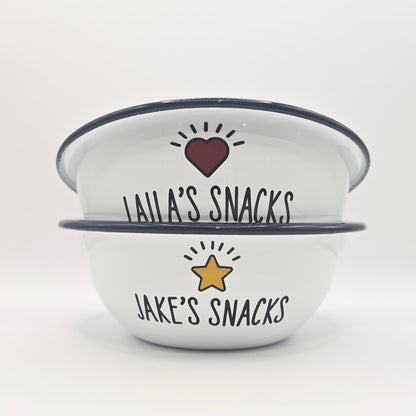 Kids Personalised white metal enamel snack bowl. White enamel metal bowl with navy blue rim. Printed with a yellow star or red heart and a name with snacks written underneath. Perfect for popcorn, sweets, crisps or general snacks.