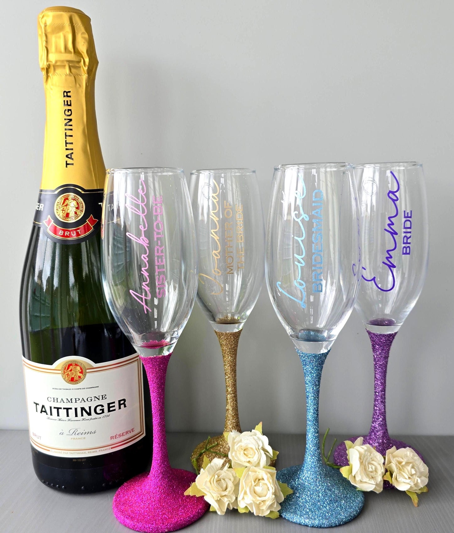 Prosecco glass or Champagne flute decorated with high shine glitter stem and personalised with a name in decorative font and wedding roll – Bride, Groom, Mother of the Bride, Bridesmaid, Sister of the bride, Maid of Honour.