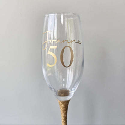 Personalised glitter stem prosecco glass or champagne flute in gold, pink, purple or Blue. Signature style custom name and an age underneath