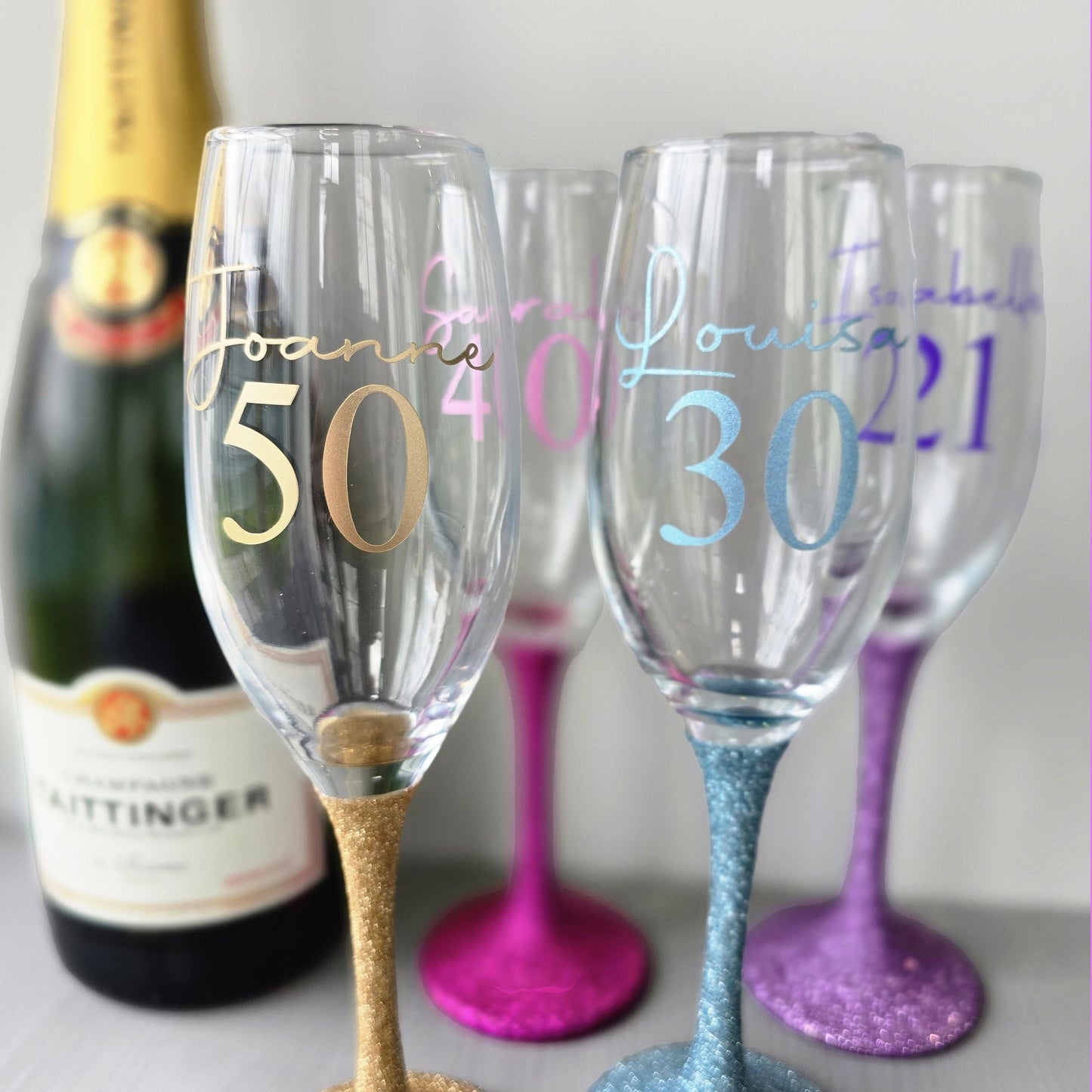 Personalised glitter stem prosecco glass or champagne flute in gold, pink, purple or Blue. Signature style custom name and an age underneath