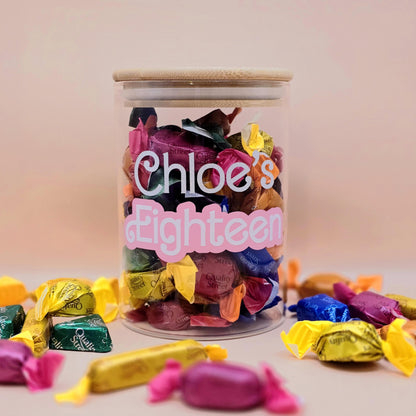 Jar of colorful candies with 'Chloe's Eighteenth' text on a light background