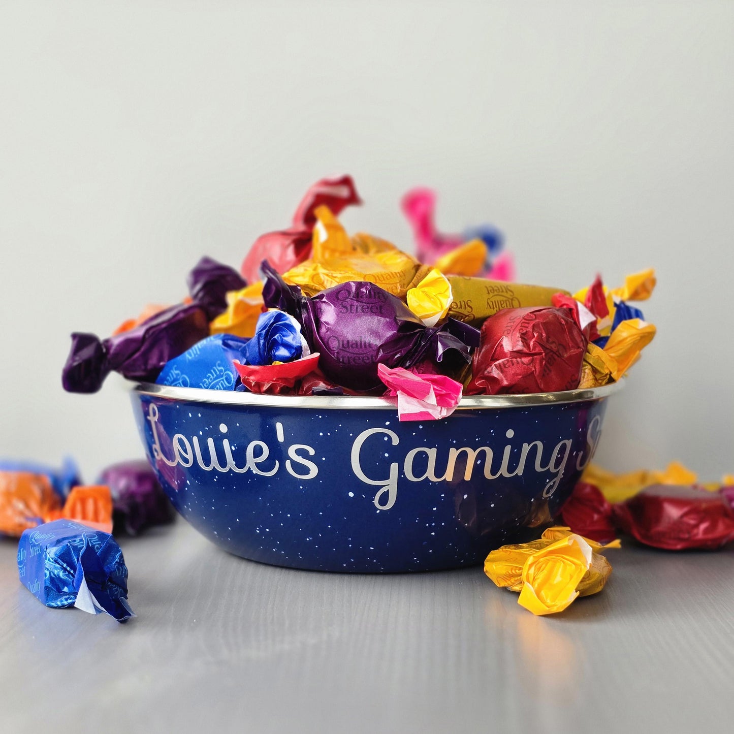 Blue steel enamel metal snack bowls with gaming snacks printed in silver decorative font.
