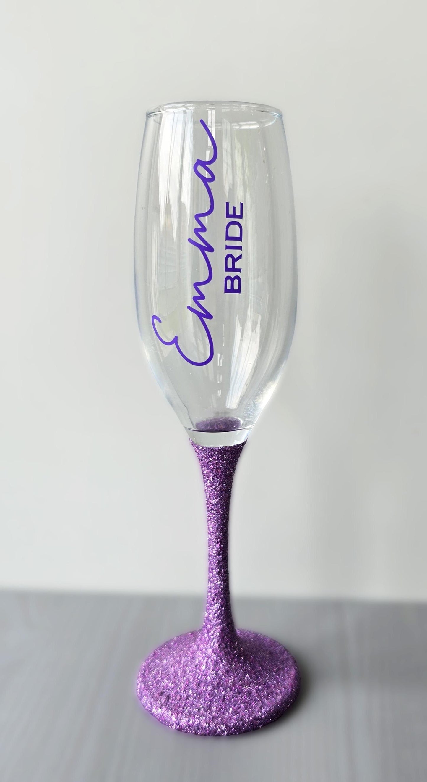 Prosecco glass or Champagne flute decorated with high shine glitter stem and personalised with a name in decorative font and wedding roll – Bride, Groom, Mother of the Bride, Bridesmaid, Sister of the bride, Maid of Honour.
